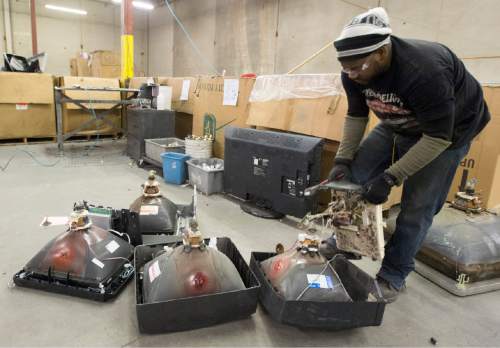 Rick Egan  |  The Salt Lake Tribune

Workers at Metech Recycling, remove parts of television and computer monitors for recycling so no damage is done to the environment, Friday, March 20, 2015.