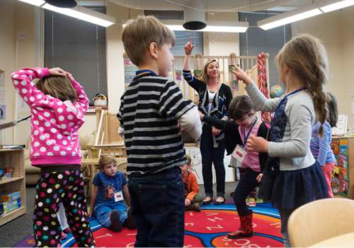 Steve Griffin  |  The Salt Lake Tribune

Erika Gustafson dances with her preschool children during class at the Child and Family Development Center, which is the laboratory school at the University of Utah, in Salt Lake City, Tuesday, April 7, 2015.