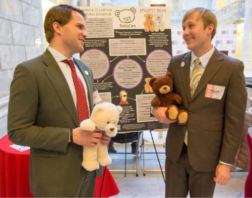 Rick Egan  |  The Salt Lake Tribune

Bryan Jensen (left) and Patrick Loftus  hold their Teddy Care bears that they developed, as University of Utah students showcased a variety of inventions during the fifth annual Bench-2-Bedside (B2B) competition at the Utah State Capitol Rotunda, Wednesday, April 8, 2015.