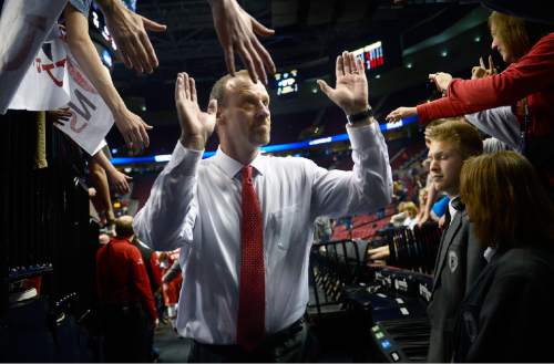 Scott Sommerdorf   |  The Salt Lake Tribune
Utah Utes head coach Larry Krystkowiak leaves the court after Utah defeated Georgetown 75-64 to advance to the "Sweet Sixteen", Saturday, March 21, 2015.