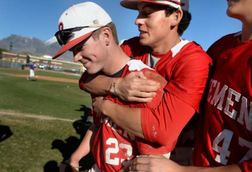 Scott Sommerdorf   |  The Salt Lake Tribune
Centerfielder KAsten Rassmussen, left, is congratulated by Seth Taylor after American Fork defeated Lehi 3-1, Friday, April 10, 2015. Rassmussen made a spectacular catch in CF to keep Lehi from mounting a comeback in the 7th inning, and helping to seal the win.