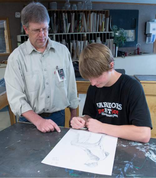 Rick Egan  |  The Salt Lake Tribune

Art teacher, Daren Wilding helps Brad Gray  with an art project during class at Weber High School. Gray was recently named as the winner of  the 2015 Utah Junior Duck Stamp contest. Friday, April 10, 2015.
