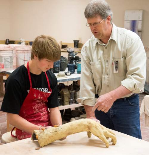 Rick Egan  |  The Salt Lake Tribune

Art teacher, Daren Wilding helps Brad Gray  with an art project during class at Weber High School. Gray was recently named as the winner of  the 2015 Utah Junior Duck Stamp contest. Friday, April 10, 2015.