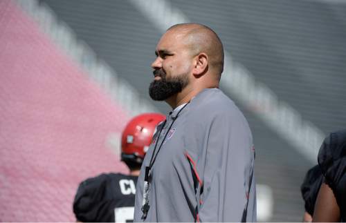 Scott Sommerdorf   |  The Salt Lake Tribune
Tight ends coach Lewis Powell watches play during University of Utah Spring scrimmage at Rice-Eccles Stadium, Saturday, April 11, 2015.