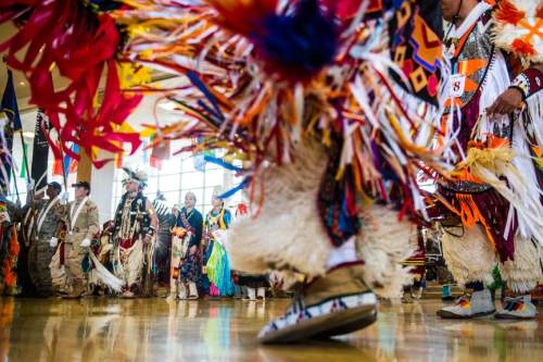 Chris Detrick  |  The Salt Lake Tribune
Participants enter during the ceremonial Grand Entry during the 43rd annual Sustaining our Culture Powwow presented by University of Utah's Inter-Tribal Student Association at the University of Utah Union Ballroom Saturday April 11, 2015.