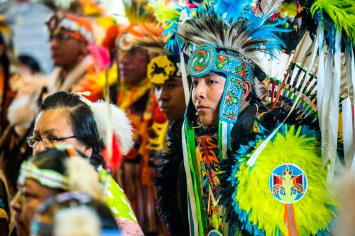 Chris Detrick  |  The Salt Lake Tribune
Participants enter during the ceremonial Grand Entry during the 43rd annual Sustaining our Culture Powwow presented by University of Utah's Inter-Tribal Student Association at the University of Utah Union Ballroom Saturday April 11, 2015.