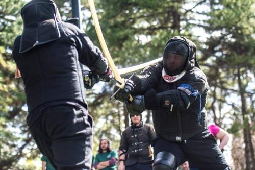 Chris Detrick  |  The Salt Lake Tribune
Jordan Hinckley, right, and Dave Maxfield compete at Liberty Park Saturday April 11, 2015. The United Clans Swordsman Association and the True Edge Academy of Swordsmanship competed in their first-ever sword competition between the two groups. Both organizations are members of the national nonprofit Historical European Martial Arts Alliance. Techniques taught include Long sword, Short Sword and buckler, Dagger, Pole hammer and unarmed fighting and defense.