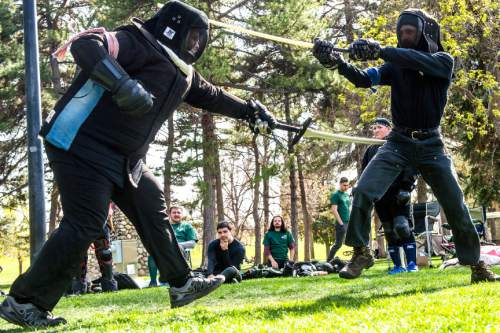 Chris Detrick  |  The Salt Lake Tribune
Sasha Pinegar, of Salt Lake City, left, and Zeb Rentz-Bjorge, of Salt Lake City, compete at Liberty Park Saturday April 11, 2015. The United Clans Swordsman Association and the True Edge Academy of Swordsmanship competed in their first-ever sword competition between the two groups. Both organizations are members of the national nonprofit Historical European Martial Arts Alliance. Techniques taught include Long sword, Short Sword and buckler, Dagger, Pole hammer and unarmed fighting and defense.