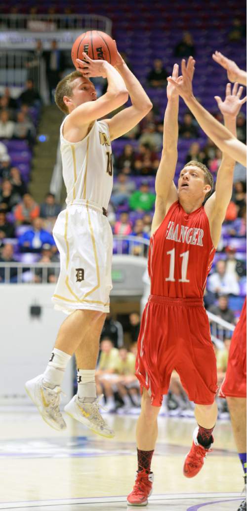 Steve Griffin  |  The Salt Lake Tribune

Davis' Jesse Wade (10) shoots over Granger's Jordan Ainslie (11) during the opening round of the boy's 5A basketball state tournament game against Davis at the Dee Events Center in Ogden, Monday, February 23, 2015.