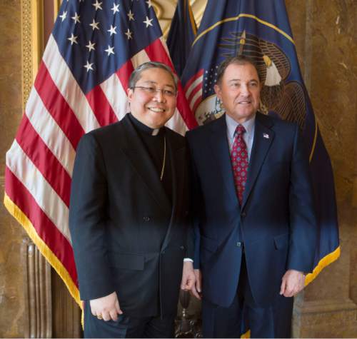 Steve Griffin  |  The Salt Lake Tribune

Archbishop Bernardito Auza, permanent observer of the Holy See to the UN, visits Utah to talk about religious freedom with Gov. Gary Herbert, right, in the Utah Capitol, Gold Room in Salt Lake City, Monday, April 13, 2015.
