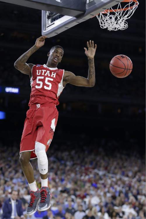 Utah's Delon Wright dunks against Duke during the first half of a college basketball regional semifinal game in the NCAA Tournament Friday, March 27, 2015, in Houston. (AP Photo/Charlie Riedel)