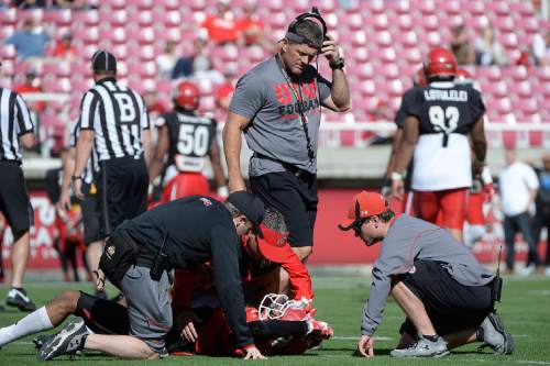 Scott Sommerdorf   |  The Salt Lake Tribune
Coach Kyle Whittingham checks o the health of WR Delshon McClellon after he took a big hit in practice. University of Utah Spring scrimmage at Rice-Eccles Stadium, Saturday, April 11, 2015.