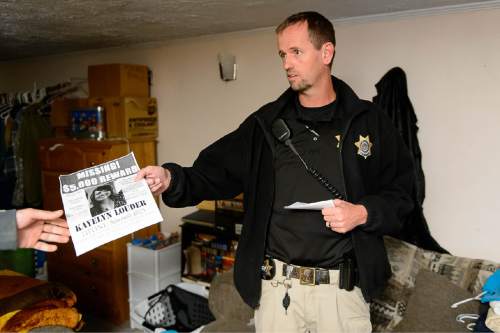 Trent Nelson  |  The Salt Lake Tribune
During a visit to the home of a probationer in West Jordan Wednesday November 19, 2014, probation Agent Jason Fairbanks hands out a flier with information on Kayelyn Louder, who disappeared from her home in Murray on Sept. 27. Adult Probation and Parole agents handed out fliers throughout the Salt Lake valley to raise awareness of the case.