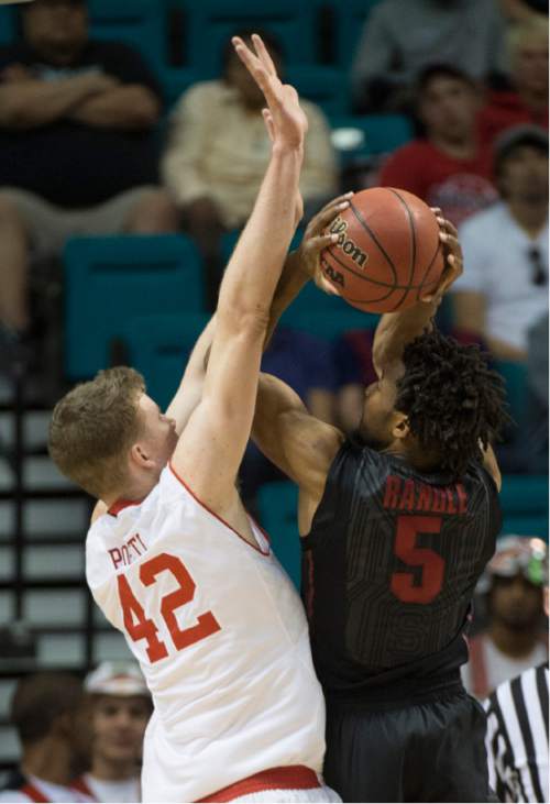 Rick Egan  |  The Salt Lake Tribune

Stanford Cardinal guard Chasson Randle (5) shoots over Utah Utes forward Jakob Poeltl (42) scores and is fouled, in Pac-12 Basketball Championship action Utah vs. Stanford, at the MGM Arena, in Las Vegas, Thursday, March 12, 2015.