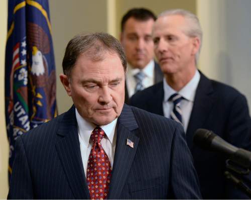 Al Hartmann  |  The Salt Lake Tribune 
Gov. Gary Herbert enters followed by Senate President Wayne Niedehauser and Speaker of the House Greg Hughes to announce a joint resolution to be passed in the Legislature to get a Medicaid expansion bill done by summer 2015.