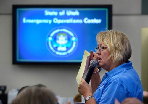 Scott Sommerdorf   |  The Salt Lake Tribune
Sheila Curtis, emergency preparedness planner, briefs the room about how to proceed during the annual Great Utah ShakeOut earthquake drill inside the Emergency Operations Center beneath the Utah State Capitol building, Thursday, April 16, 2015.