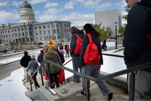 Scott Sommerdorf   |  The Salt Lake Tribune
Workers begin to head back to work after they evacuated the State Office Building during the annual Great Utah ShakeOut earthquake drill at the Utah State Capitol complex, Thursday, April 16, 2015.