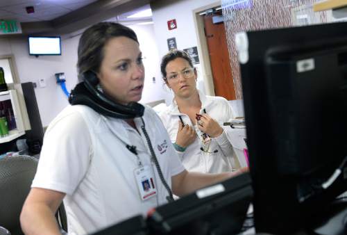 Scott Sommerdorf   |  The Salt Lake Tribune
Nurse Shasta Mitchell, right, waits to speak with Charge Nurse Mary Anderson during a shift in the UofU Emergency Room, Wednesday, April 15, 2015. Despite a national shortage of nurses, the U. is only accepting about 60 percent of qualified applicants.