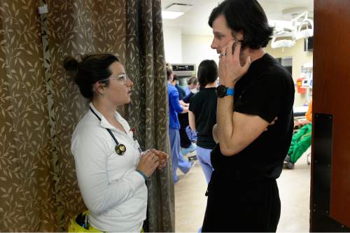 Scott Sommerdorf   |  The Salt Lake Tribune
Nurse Shasta Mitchell, left, speaks with Doctor Matthew Fuller during a shift in the UofU Emergency Room, Wednesday, April 15, 2015.