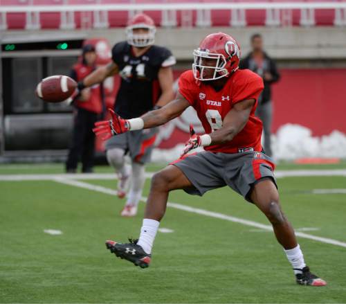 Francisco Kjolseth  |  The Salt Lake Tribune 
Wide receiver Bubba Poole loses control of a pass as the University of Utah football team practices at Rice Eccles stadium on Thursday, April 16, 2015.