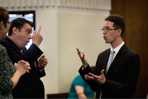 Scott Sommerdorf   |  The Salt Lake Tribune
First Counselor Ben Edwards, right, speaks in March prior to services at the Salt Lake Valley 1st Ward. The ward caters to hearing-impaired and visually impaired Mormons and conducts services in American Sign Language.