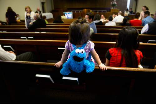 Scott Sommerdorf   |  The Salt Lake Tribune
A little girl brightens the room prior to services at the Salt Lake Valley 1st Ward. The ward caters to hearing-impaired and visually impaired Mormons and conducts services in American Sign Language, Sunday, March 29, 2015.