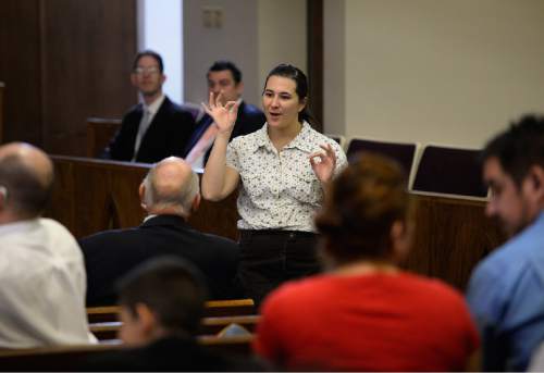 Scott Sommerdorf   |  The Salt Lake Tribune
Michelle Harmish speaks prior to services at the Salt Lake Valley 1st Ward. The ward caters to hearing-impaired and visually impaired Mormons and conducts services in American Sign Language, Sunday, March 29, 2015.