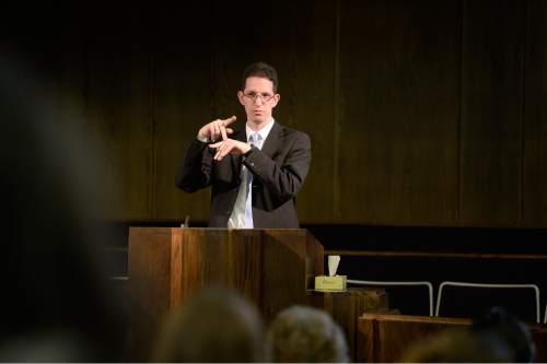 Scott Sommerdorf   |  The Salt Lake Tribune
First Counselor Ben Edwards delivers some calendar items prior to services at the Salt Lake Valley 1st Ward. The ward caters to hearing-impaired and visually impaired Mormons and conducts services in American Sign Language, Sunday, March 29, 2015.