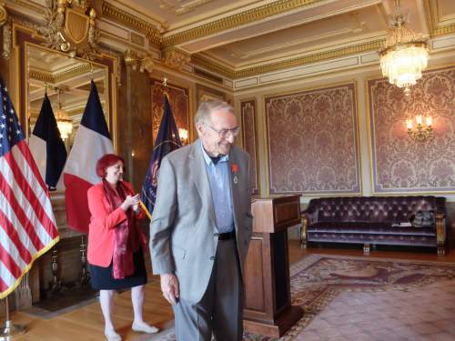 Sam Boyack looks at his family after receiving the French Legion of Honor from  Honorary  Consul of France Marie-Helene Glon on April 18, 2015, in a ceremony at the state Capitol. Boyack, 91, of Sandy, was in the U.S. Army Air Corps during World War II and participated in the liberation of France. Photo by Nate Carlisle/The Salt Lake Tribune
