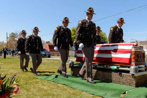 Trent Nelson  |  The Salt Lake Tribune
A Highway Patrol honor guard prepares to fold the flag at the funeral of former Utah Governor Norm Bangerter, in South Jordan, Saturday April 18, 2015.