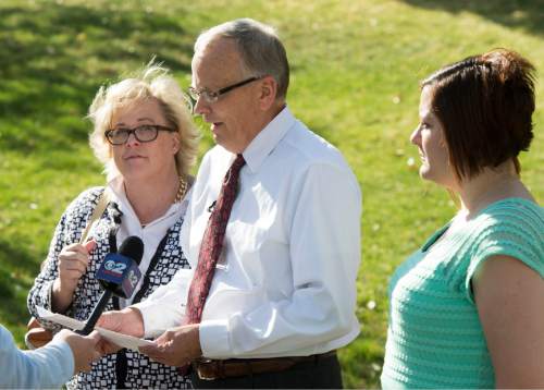 Rick Egan  |  The Salt Lake Tribune

Laura Pennock, Don Braegger and M'lisa D. Martinez talk to the media at City Creek Park about their reasons for opposing the sustaining of the leadership of the LDS Church in the Saturday afternoon session of  LDS General Conference, Saturday, April 4, 2015.