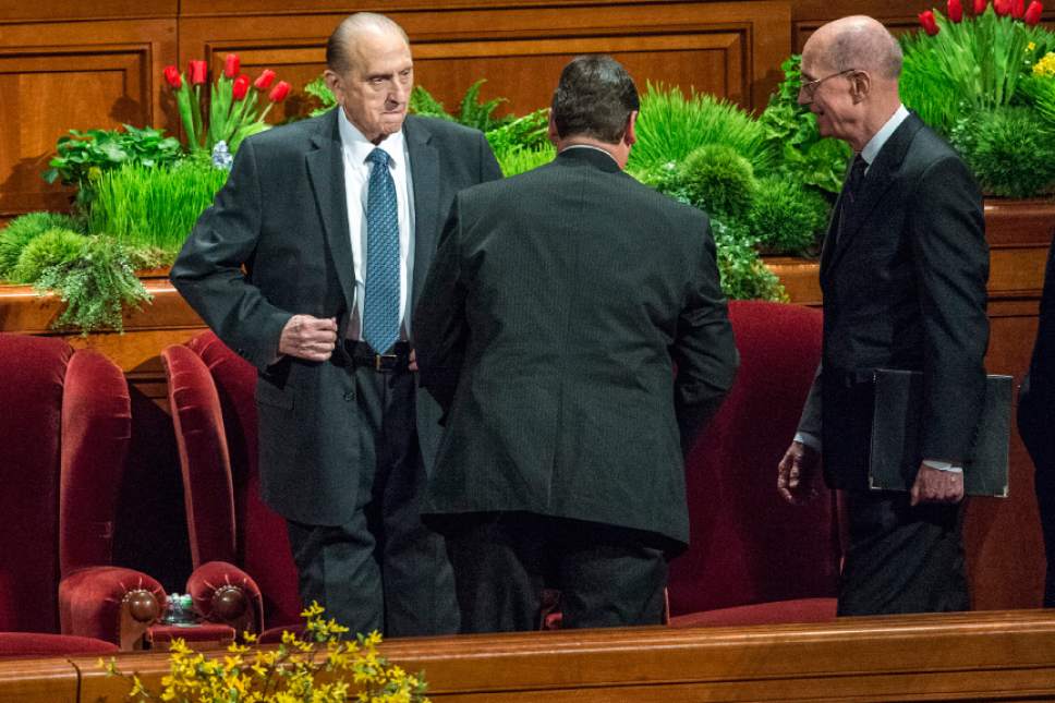 Chris Detrick  |  The Salt Lake Tribune
LDS Church President Thomas S. Monson stumbles while getting to his seat during the afternoon session of the 185th Annual LDS General Conference Saturday April 4, 2015.