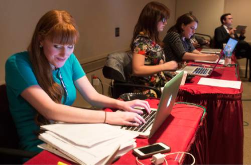 Rick Egan  |  The Salt Lake Tribune

Reporters Sonja Carlson, Ogden Standard-Examiner, and MacKenzie Holbrook, and Lindsey Johnson, of BYU-Idaho, cover the185th Annual LDS General Conference Priesthood Session in the media room, Saturday, April 4, 2015.