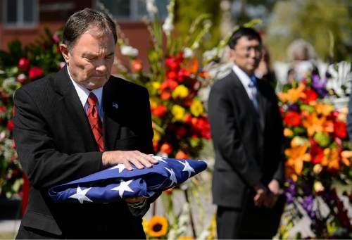 Trent Nelson  |  The Salt Lake Tribune
Utah Governor Gary Herbert with the flag at the funeral of former Utah Governor Norm Bangerter, in South Jordan, Saturday April 18, 2015.