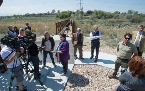 (Steve Griffin  |  The Salt Lake Tribune)  
Members of the U.S. Environmental Protection Agency joined state and local officials and business leaders in Midvale on Monday, April 20, 2015, to announce the removal of the former Midvale Slag site from the Superfund National Priorities List. The 446-acre property, pictured here, a former ore processing and smelting facility adjacent to the Jordan River, has been the subject of intensive cleanup activity and is now a thriving mixed-use redevelopment known as Bingham Junction.
