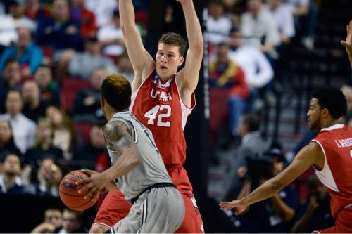 Scott Sommerdorf   |  The Salt Lake Tribune
Utah Utes forward Jakob Poeltl (42) defends against Georgetown Hoyas guard D'Vauntes Smith-Rivera (4) during second half play. Utah defeated Georgetown 75-64 to advance to the "Sweet Sixteen", Saturday, March 21, 2015.