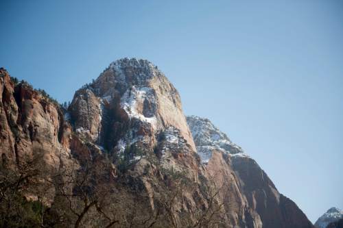 Jeremy Harmon  |  The Salt Lake Tribune
Snow sits high on the cliffs of a rock formation at Zion National Park last week.