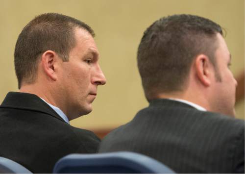Rick Egan  |  The Salt Lake Tribune

John Coyle (left) and attorney Blake Hamilton, await the decision of the West Valley City civil service commission hearing, Thursday, May 15, 2014. The commission overturned Coyles' demotion and ordered the department to award him back pay.