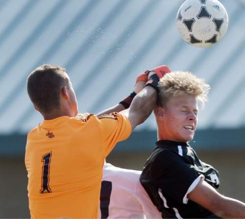 Steve Griffin  |  The Salt Lake Tribune

Brighton goal keeper Conner Dearden knocks the ball away from  Alta's Daniel Tree during boy's soccer game at Brighton High School in Cottonwood Heights, Tuesday, April 21, 2015.