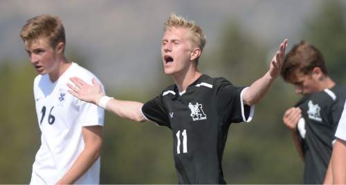 Steve Griffin  |  The Salt Lake Tribune

Alta's Bryson Colemere can't believe a foul wasn't called during the Brighton versus Alta boy's soccer game at Brighton High School in Cottonwood Heights, Tuesday, April 21, 2015.