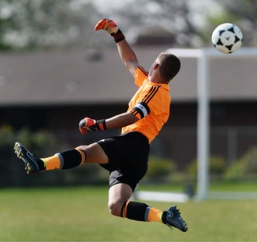 Steve Griffin  |  The Salt Lake Tribune

Brighton goal keeper Conner Dearden leaps to deflect a shot during the Brighton versus Alta boy's soccer game at Brighton High School in Cottonwood Heights, Tuesday, April 21, 2015.