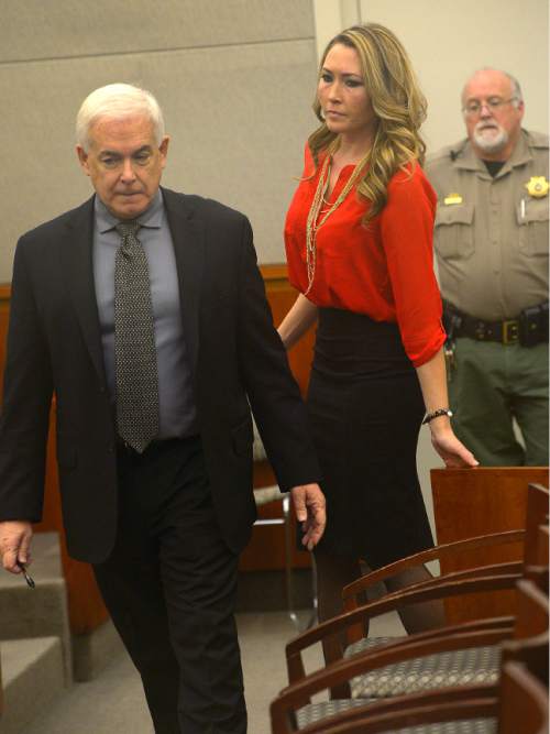 Leah Hogsten  |  The Salt Lake Tribune
Brianne Altice heads into the courtroom with her attorney Ed Brass for a preliminary hearing in Judge John R. Morris' 2nd District Court, Thursday January 15, 2015.  Altice, was taken into custody and is headed to trial with 10 felony counts for alleged sexual relationships with three teens: five counts of first-degree felony rape, two counts of first-degree felony forcible sodomy and three counts of second-degree felony forcible sexual abuse in connection with allegedly having sex with the three male students.