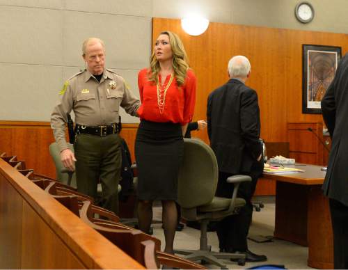 Leah Hogsten  |  The Salt Lake Tribune
Brianne Altice, 35, was taken into custody and ordered to stand trial in 2nd District Court after Judge John R. Morris refused to set bail, Thursday, January 15, 2015. Altice,  is facing a total of 14 felony charges for allegedly having sexual relationships with three male students: five counts of first-degree felony rape, two counts of first-degree felony forcible sodomy, three counts of second-degree felony forcible sexual abuse, along with three counts of unlawful sexual activity with a minor and one count of dealing harmful material to a minor, all third-degree felonies.