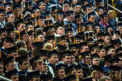Chris Detrick  |  The Salt Lake Tribune
BYU students listen during Brigham Young University's Commencement Exercises at the Marriott Center Thursday April 23, 2015. A total of 5881 students from 10 colleges received degrees at the ceremonies, with 5004 students receiving bachelor's degrees, 692 students receiving master's degrees and 185 receiving doctoral degrees.