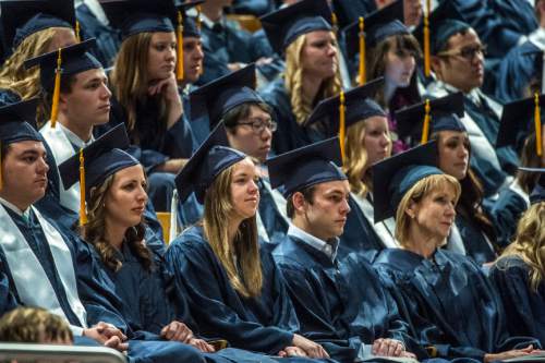 Chris Detrick  |  The Salt Lake Tribune
BYU students listen during Brigham Young University's Commencement Exercises at the Marriott Center Thursday April 23, 2015. A total of 5881 students from 10 colleges received degrees at the ceremonies, with 5004 students receiving bachelor's degrees, 692 students receiving master's degrees and 185 receiving doctoral degrees.