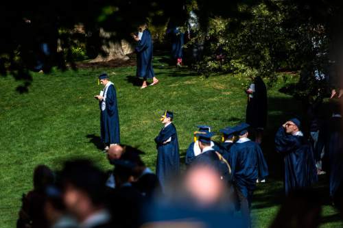 Chris Detrick  |  The Salt Lake Tribune
BYU graduates mingle outside after Brigham Young University's Commencement Exercises at the Marriott Center Thursday April 23, 2015. A total of 5881 students from 10 colleges received degrees at the ceremonies, with 5004 students receiving bachelor's degrees, 692 students receiving master's degrees and 185 receiving doctoral degrees.