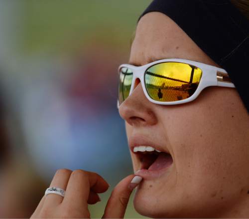 Steve Griffin  |  The Salt Lake Tribune

Woods Cross pitcher Hanalee Robinson cheers from the bench during the Cyprus versus Woods Cross softball game at Cyprus High School in Magna, Wednesday, April 22, 2015.