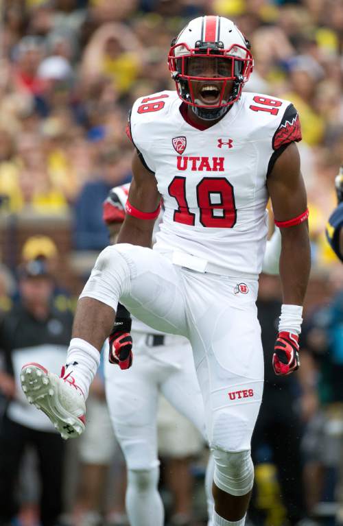 Jeremy Harmon  |  The Salt Lake Tribune

Utah's Eric Rowe (18) celebrates a tackle as the Utes face the Wolverines in Ann Arbor, Saturday, Sept. 20, 2014.