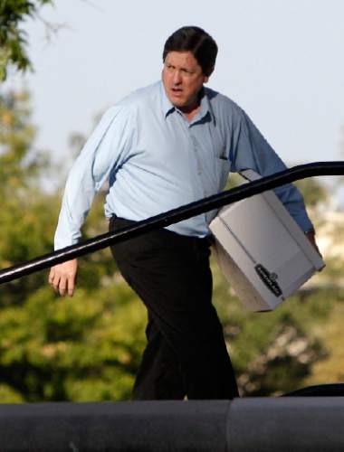 Lyle Jeffs, brother of Polygamist religious leader Warren Jeffs, arrives carrying a box of defense materials in the sexual assault trial against Warren at  the Tom Green County Courthouse Thursday Aug. 4, 2011, in San Angelo, Texas.  (AP Photo/Tony Gutierrez)