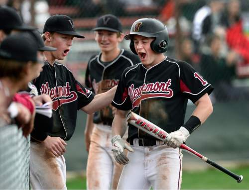 Scott Sommerdorf   |  The Salt Lake Tribune
Viewmont's Zack Larson, right, celebrates with team mates after he scored the Viking's 3rd run in the sixth to make the score 3-1. Viewmont defeated Northridge 3-1, Friday, April 24, 2015.